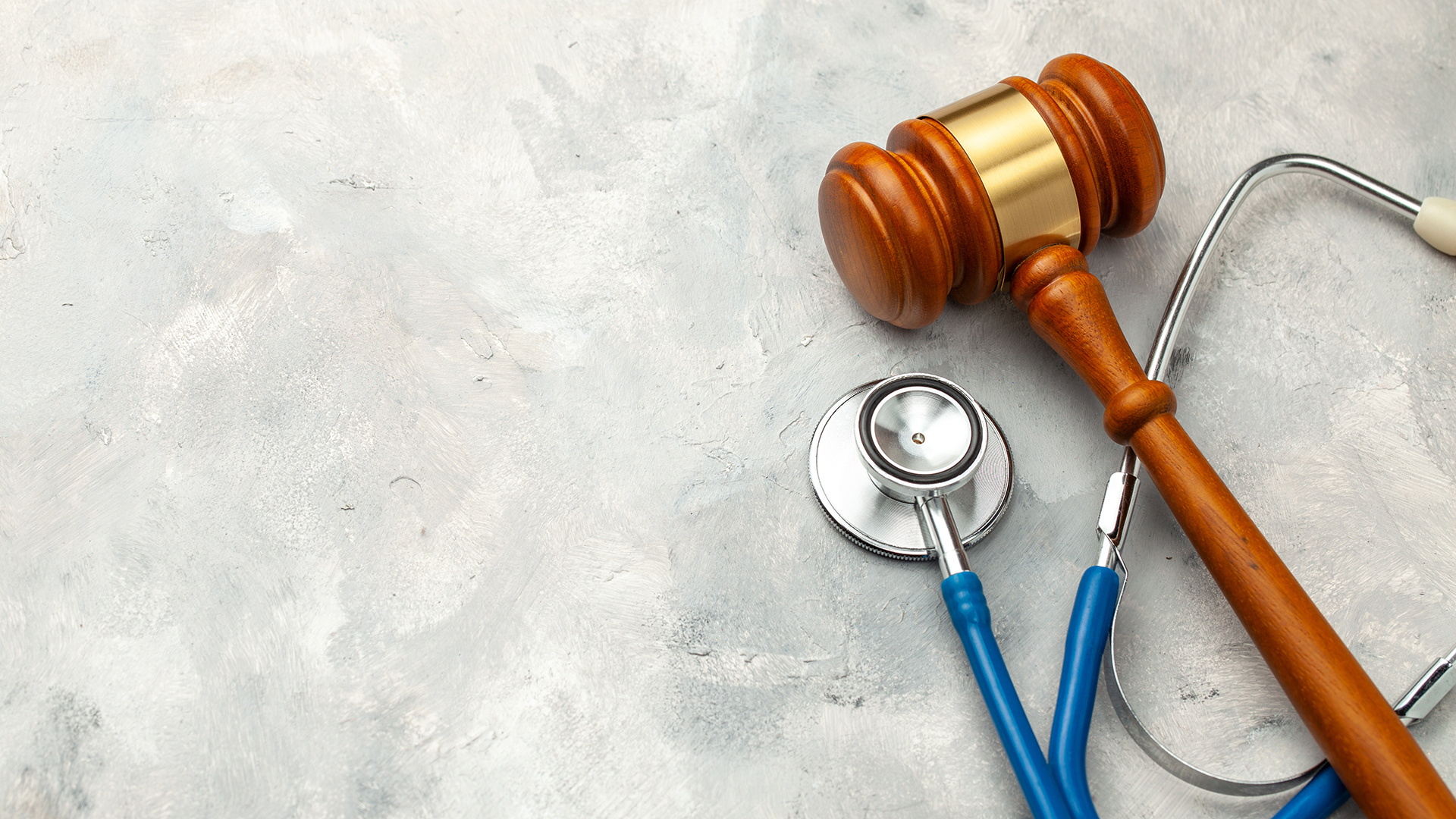 a stethoscope and a wooden gaven on a table