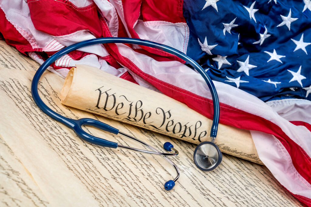 a stethoscope laying on top of an american flag