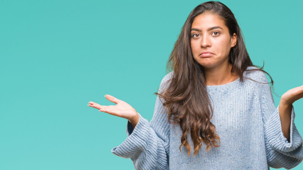 a woman with long hair is holding out her hands